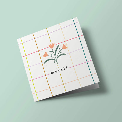 Prairie - un bouquet de fleurs sur fond quadrillé, merci