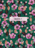 Say it with flowers - Merci ! - pink flowers on fir green background