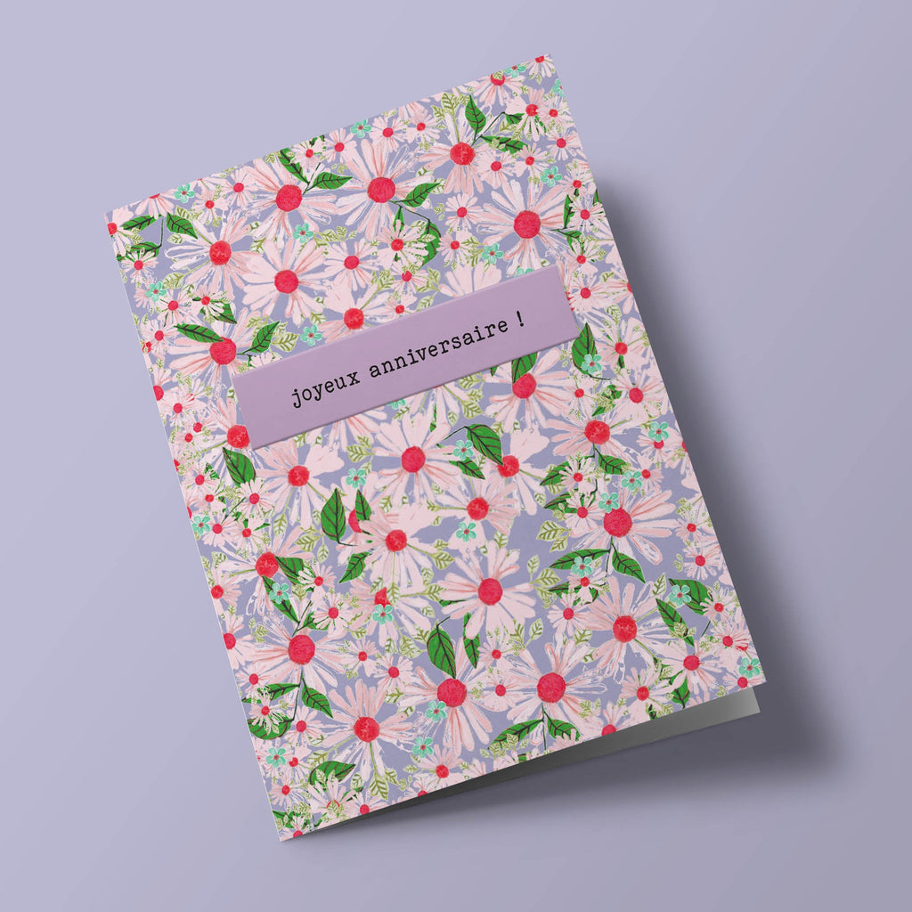 Joyeux anniversaire - pink and green daisies on purple background